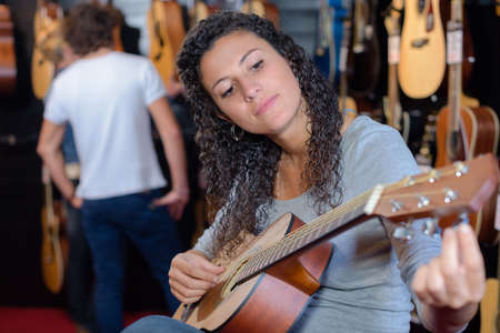 tuning the guitarの写真素材