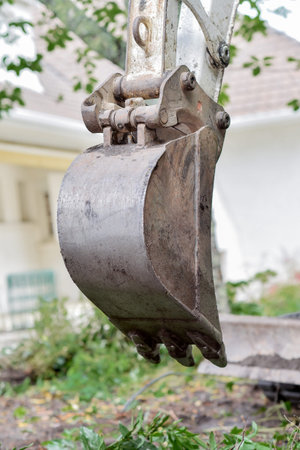 Digger parked in a garden
