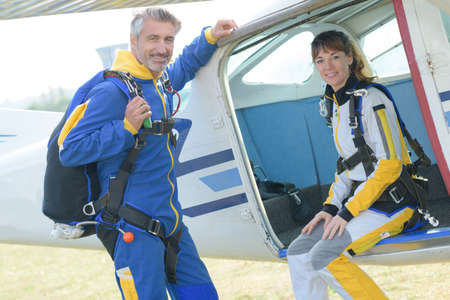 Portrait of male and female parachutistsの写真素材