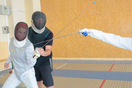 Lady training to fence