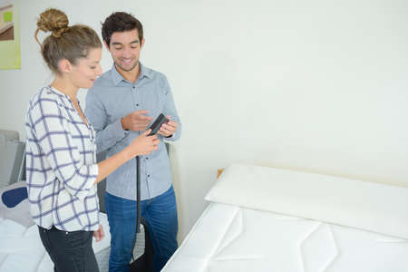 woman looking to buy adjustable bedの写真素材