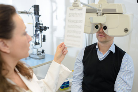 Man behind optician's equipment