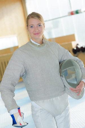 Woman wearing fencing outfit