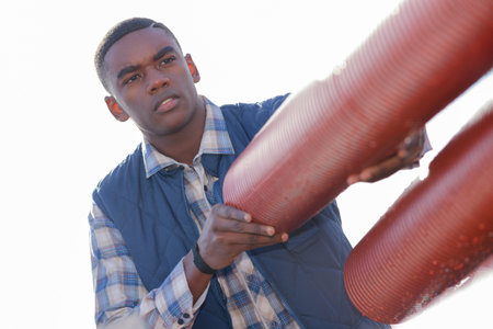 builder transporting pipes