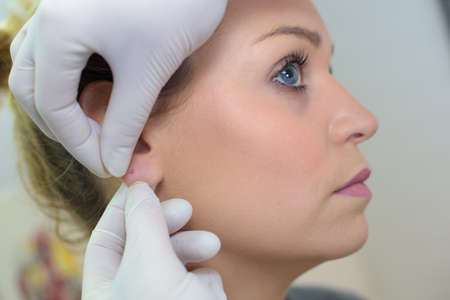 having ear piercedの写真素材