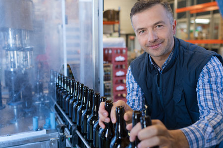 Man overseeing bottling plant