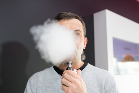 Man obscured behind a cloud of vaporizer smoke