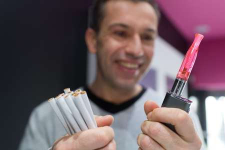 man holding a electronic cigaretteの写真素材