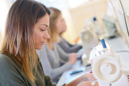 Women using sewing machinesの写真素材