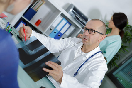 Doctor showing xray to patient