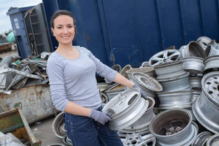 woman mechanic holding car axleの写真素材
