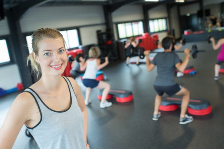Portrait of pretty female in modern fitness room