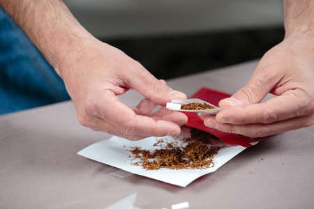 rolling a cigaretteの写真素材