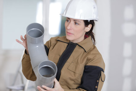 female plumber canalisation pipes