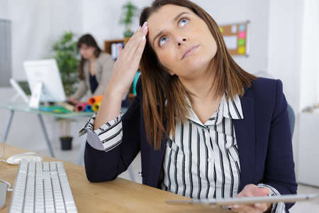 focus serious busy female office workerの写真素材