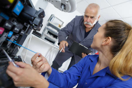 Technician working on photocopierの写真素材