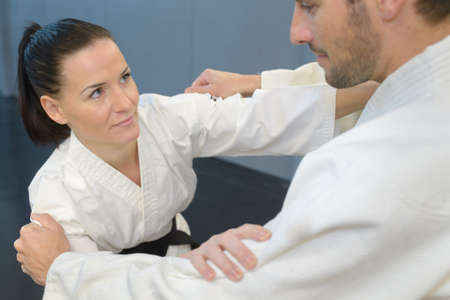 Man and woman in karate combatの写真素材