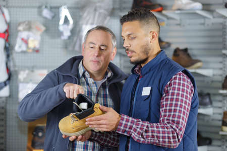 buying mountain bootsの写真素材