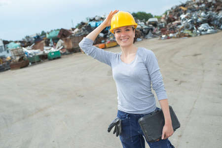 Portrait of woman in scrapyardの写真素材