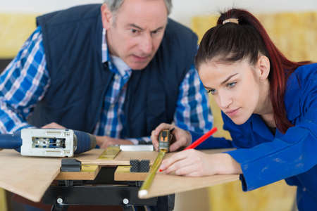 Young woman learning carpentryの写真素材