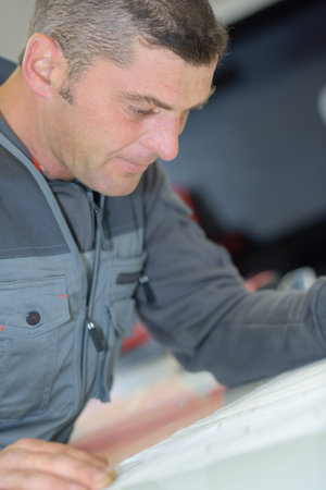 Closeup of workman concentrating