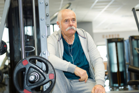 senior man in gym working out