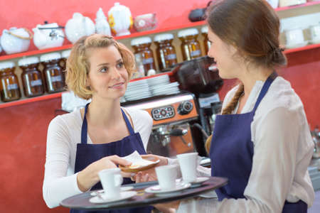 coffee shop baristas workingの写真素材