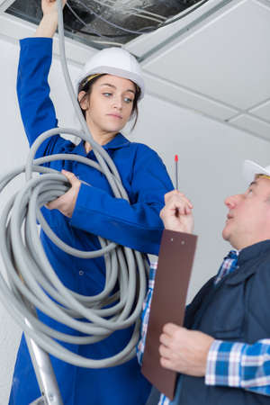female electrician with cablesの写真素材
