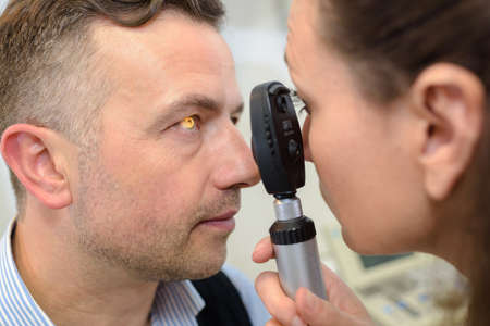 man having eye test eye test machineの写真素材
