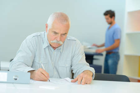 old man deepens his knowledge and cultureの写真素材