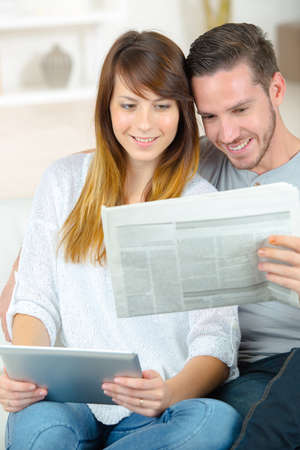 reading the same news from different sourcesの写真素材