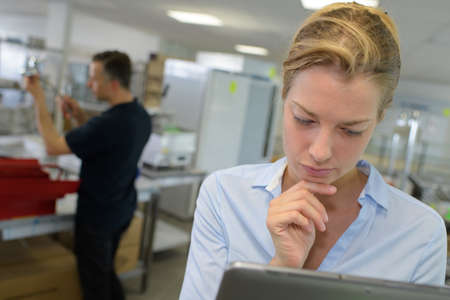 boutique owner using a digital tabletの写真素材