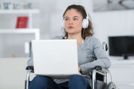 disabled handicapped girl with laptop computerの写真素材