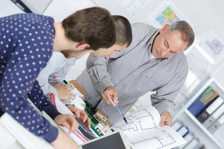 students and teacher in architecture working on projectの写真素材