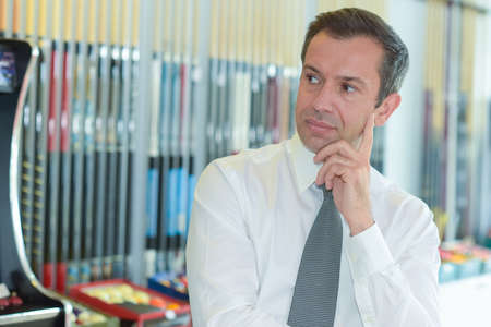 businessman thinking in his officeの写真素材