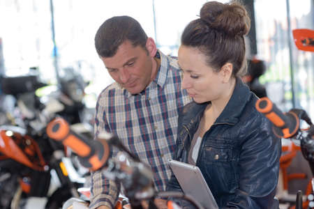 man choosing his new motorbikeの写真素材