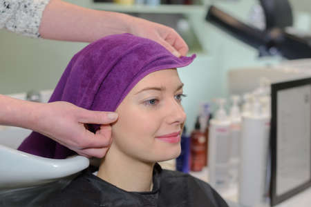 beautiful woman sitting in the hairdressing salonの写真素材