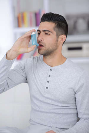 man suffering from asthma following a treatmenの写真素材