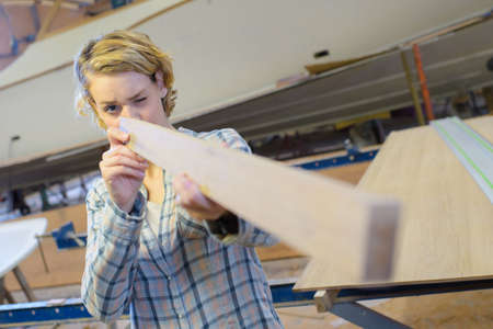 woman as carpenter during apprenticeship lessonの写真素材