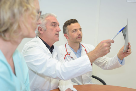 two doctor checking x ray filmの写真素材