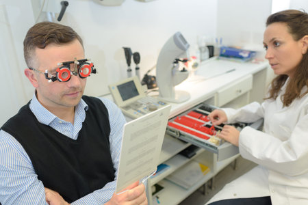 Man reading text while wearing optometrists glasses