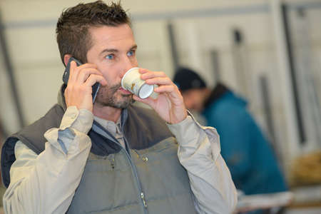 Man coffee break using phoneの写真素材