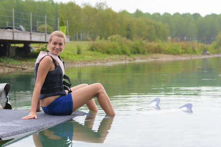 beautiful blond active woman spending summer holidays on the beachの写真素材