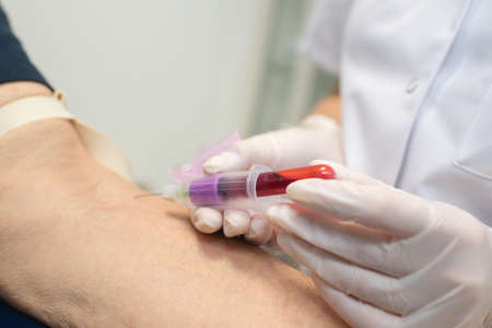 nurse taking a blood sampleの写真素材