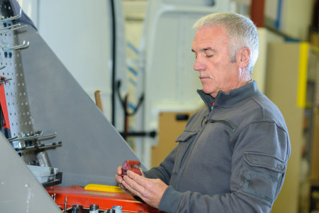 cheerful mature professional mechanic man