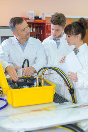 tutor explaining pipework to students