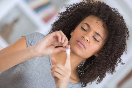 Lady with plaster on fingerの写真素材