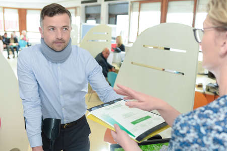 man wearing neck brace claiming insurance helpの写真素材