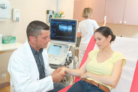 consoling a patientの写真素材