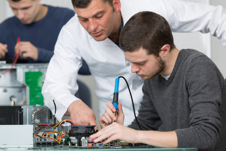 electronic students and teacher in class